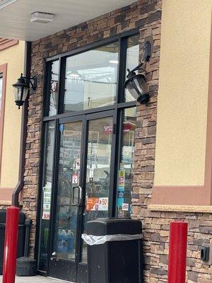 The lack of maintenance here is apparent before you walk in the door (right light).