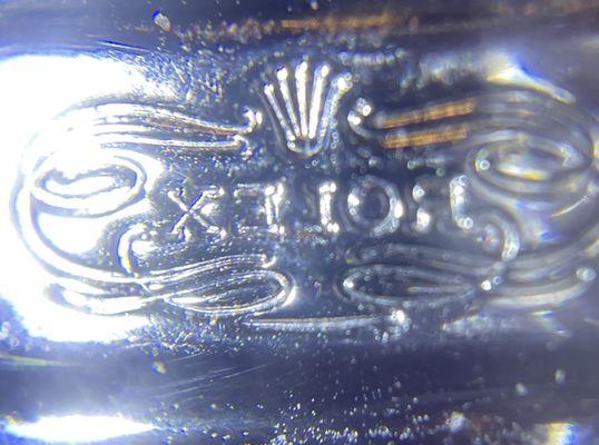 Backwards logo on band