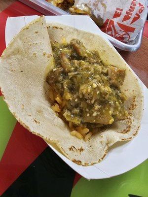 Green salsa chicharrón taco