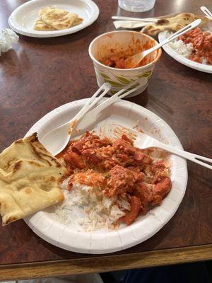 Butter chicken, naan and basmati rice.