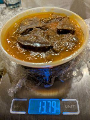 Under 14 ounces (with container) for $12. Two weeks prior, I got twice the amount for $8 and with white rice too.