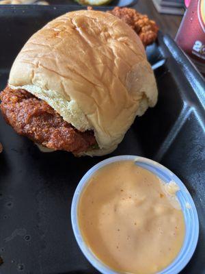 Tender slider with no slaw and a side of sauce