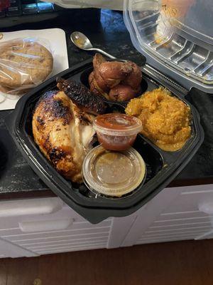 Roast quarter chicken with side of gravy squash, and roasted potatoes