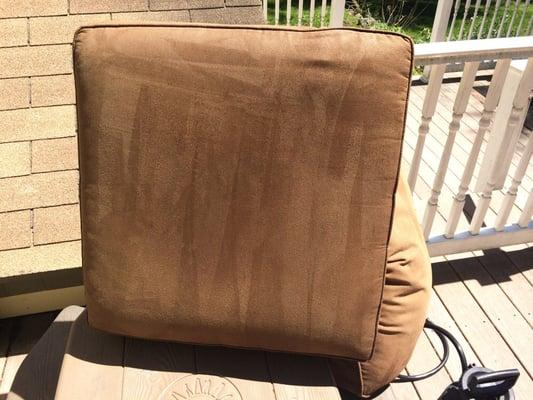 Pillows of a polyester sofa drying after a deep steam and shampoo extraction cleaning