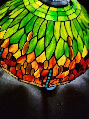 Tiffany style
dragonfly lamp
approximately 23 in. across center and approximately 12-14 in. tall. Unique turquoise body on dragonfly