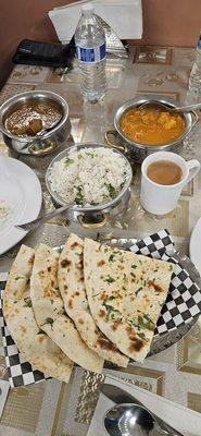 Mixed vegetable kurma and lamb curry with garlic naan.