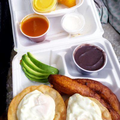 Huevos divorciados. Very good. I must say they have improved the packaging. With a side of Chicken Empanadas.