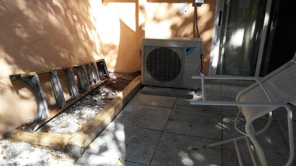 Dirty patio with ladder decor outside of our room #4