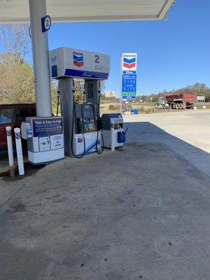 Gas pump and street sign