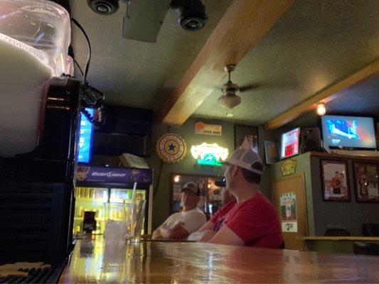 Group of guys watching automotive fix it stuff and loving it!