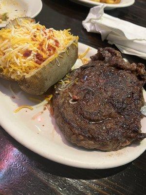 Ribeye with loaded baked potato