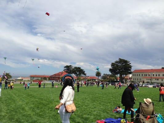 On the bottom right, sitting, is Tyrus Wong, flying the highest owl kite ( hand made by himself)