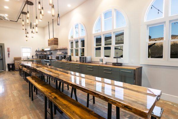 Enjoy our 40 foot live edge table, chef kitchen with 30+ feet counter space. Good Life Resorts Sanctuary 6 bedroom vacation rental.