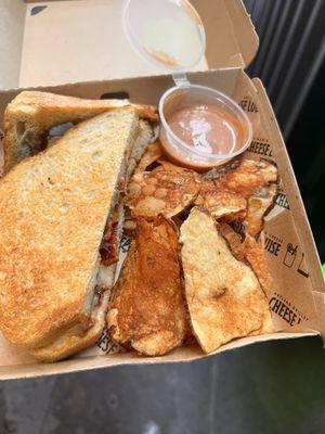 Forgive my mostly eaten other half, you do get a whole sandwich! The Baconator with a side of chips and sauce.