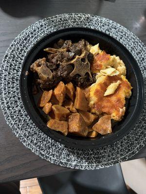 Oxtail, candied yams, Mac and Cheese