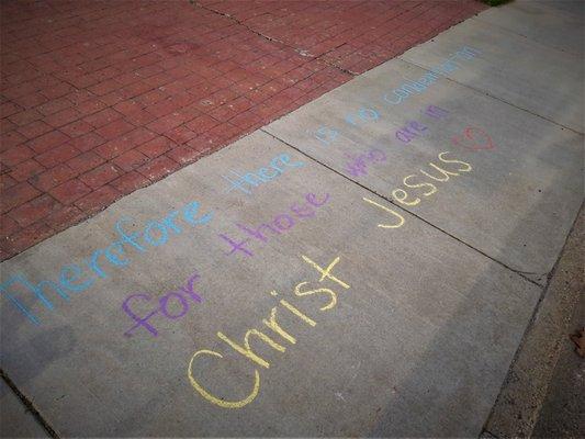 "Therefore there is no condemnation for those who are in Christ Jesus," written on NCF's sidewalk in chalk on Sunday, April 24, 2022.