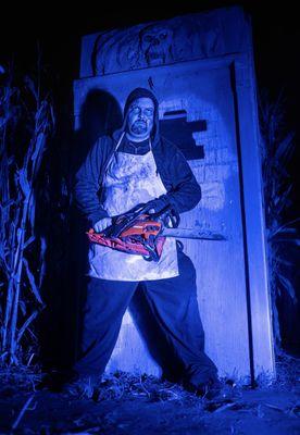 This chainsaw maniac will get you! Field of Fear Haunted House in West Haven Utah.