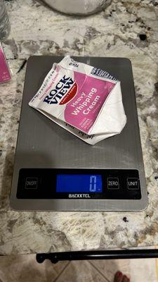 Empty box on my scale to get the best results possible in milliliters weight