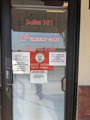 Front door with hours of operation