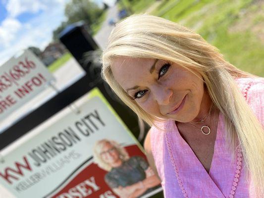 New listing sign being placed at a residential home in Greeneville, TN.