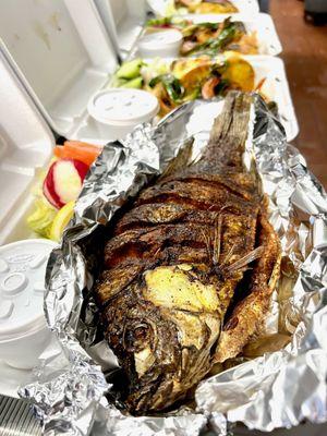 Crispy and flavorful Mojarra frita ready to take home!