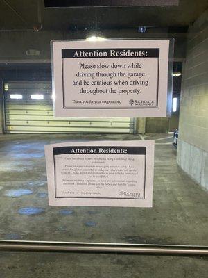 Signs posted in garage by apartment