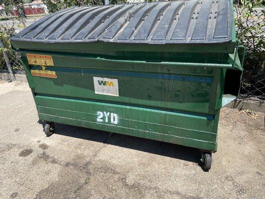 A green dumpster @ Tye Willow Ballroom