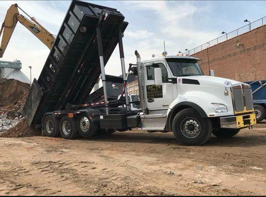 Dropping off a container at the site.
