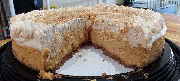 Pumpkin cheesecake with whipped cream topping