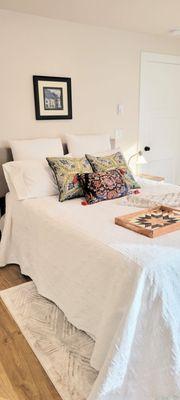 Queen size room with full bathroom , office desk and TV