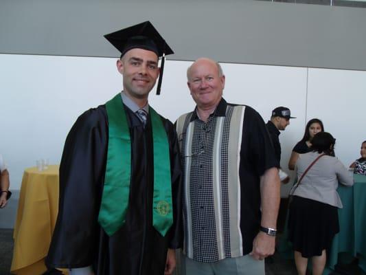 Professor James Babcocok with one of our graduates.