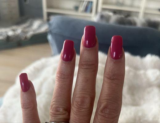 Acrylic nails with gel polish in the shade Pink Flamingo.