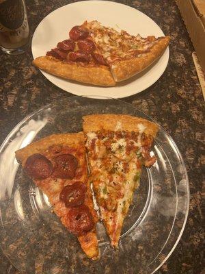 Slices of chicken tikka pizza and pepperoni pizza