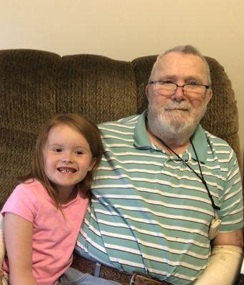 Archie enjoying a visit from his great granddaughter