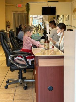 Emma getting her candy cane nails