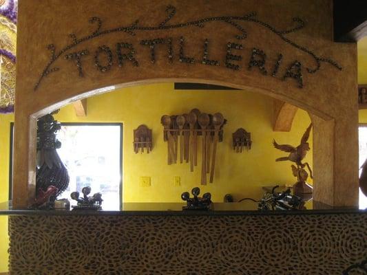 The lady making tortillas station