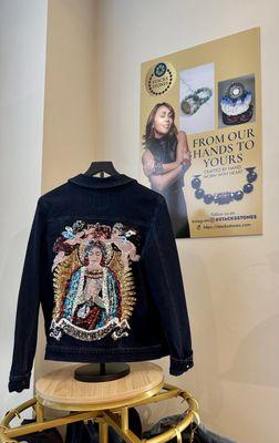 Another gorgeous jacket and the artist is on the poster behind the jacket. She waited on us and was so nice.