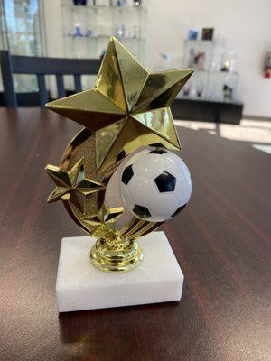 Soccer trophy with a ball that rotates