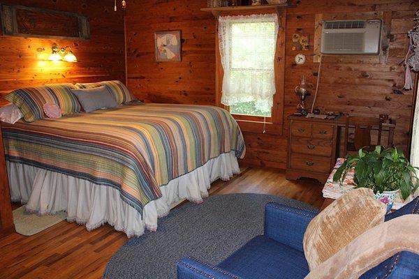 The Mountain View room is newly updated with comforter/shams, an upholstered chair and bench for the antique vanity.