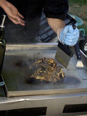 Marinated white mushrooms before they were chopped on grill