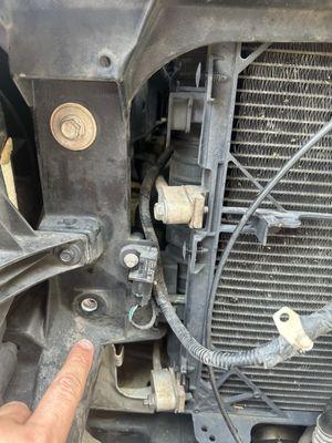 Immediately visible missing bolt.