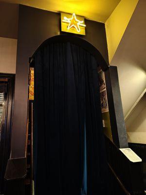 Speakeasy entrance inside pizzeria