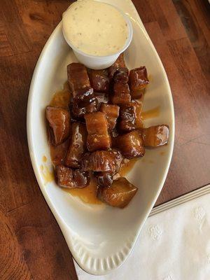Pork belly bites in sweet chili sauce (also other sauces to choose from but I would recommend the sweet chili)
