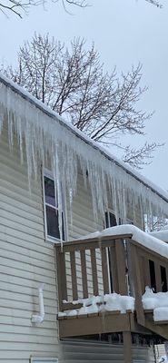 Icicles are so large they touch my deck railing from heat loss in my attic.