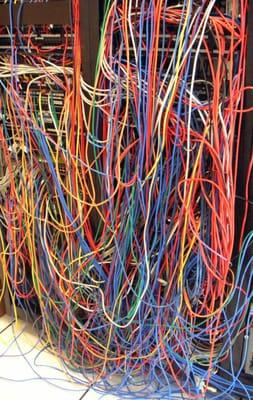 Hanging cables is very bad for the patch panels and switch ports.