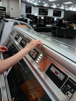 Post Construction cleaning, one of our wodnerful staff is using a cotton swab inside the crevice of this machine. Dust can hide anywhere!