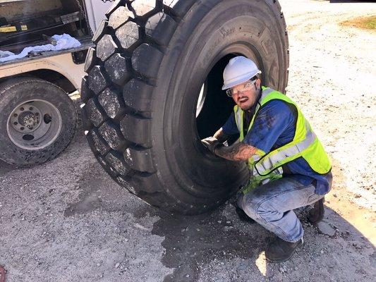 Getting new Yokohama tire ready to install on loader