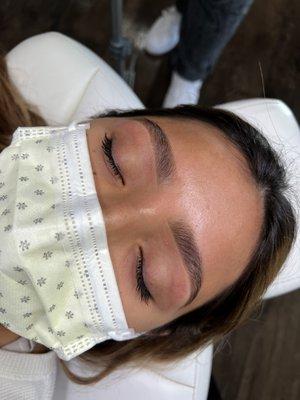 Brow wax styled with brow pencil and highlighter.