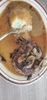 Hamburger steak with mushrooms and mashed potatoes