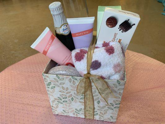 Mary Kay Ped Set for relaxing your feet. Comfy socks, Russell Stover Chocolates and a sparkling cider.